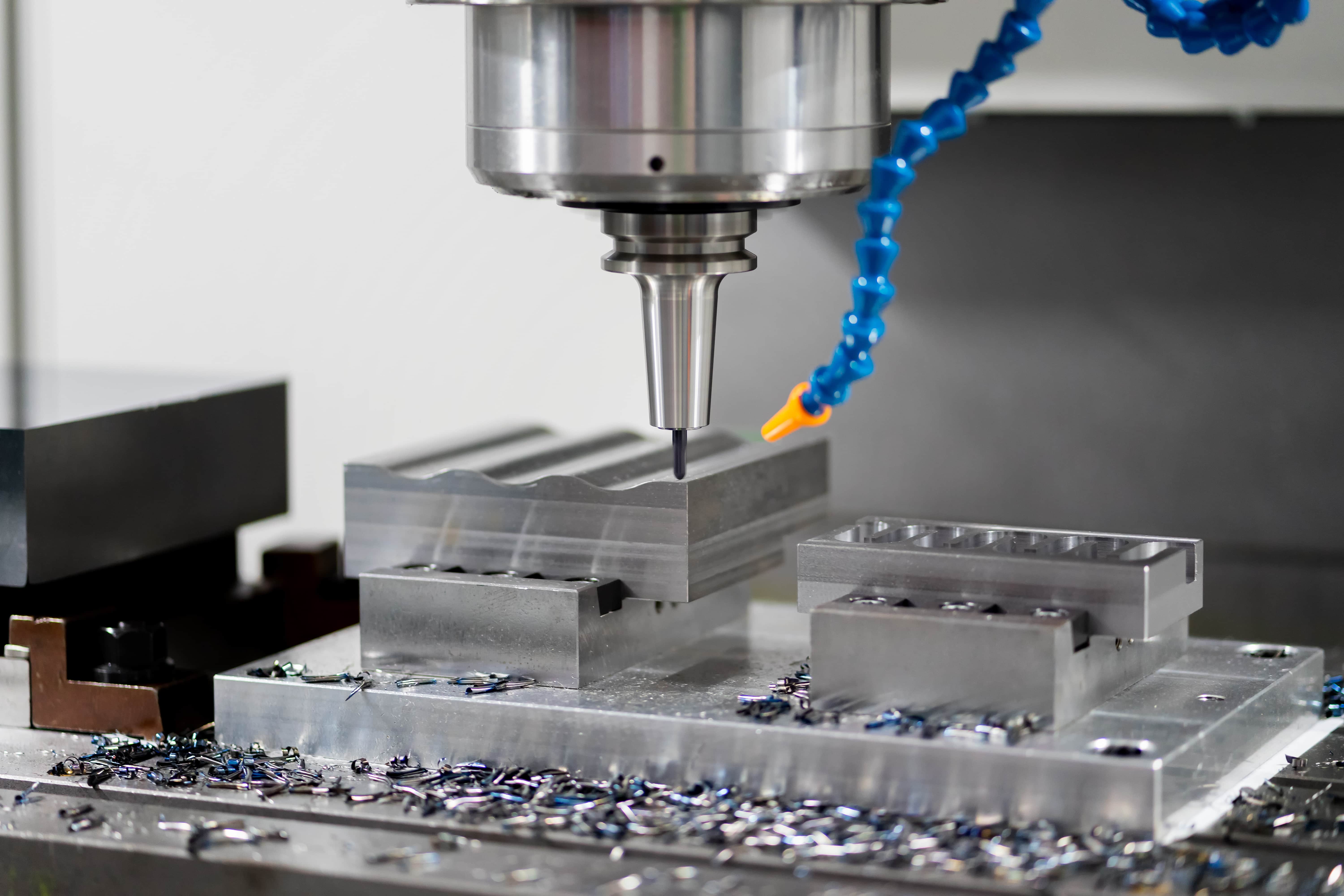 High precision CNC machining center working, operator machining automotive sample part process in the factory